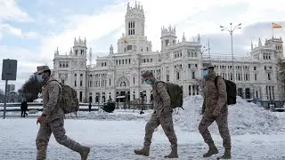 Paralysed by snowstorm, Spain sends out Covid-19 vaccine and food convoys