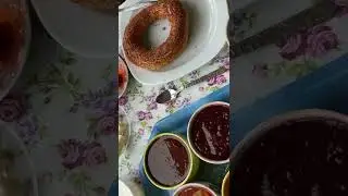Traditional Turkish breakfast at home: Olives, Sucuk, Simit and more.