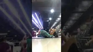 Legs behind head