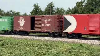 Penn Central F-units pull a freight on my HO railroad.