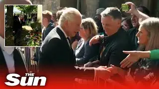 King Charles meets crowds and visits floral tributes at Holyrood Palace