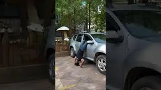 Man Enters Car While Doing Handstand