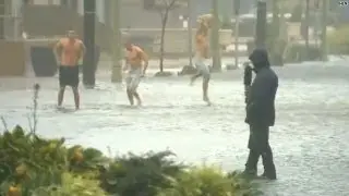 Video bomb: Men dance in storm's flooded streets