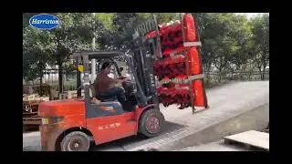 Rotary tillers and spare parts is being loaded for delivery to the customer.