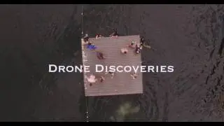 Kids jumping off dock into water,Aerial, 4K, 46s, 10of11, reflection, Mountain Lake, Canoe, Reveal,
