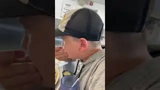 My cousin eating a lemon (in a restaurant)