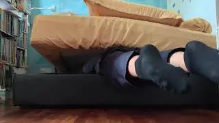 School Boy Stuck headfirst under bed in old school uniform