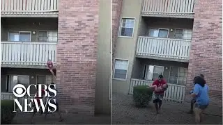 Former high school football player catches child dropped from burning building