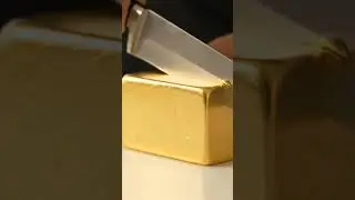 Watch this Ultra-Realistic AI-Generated Video of Cutting a Solid Gold Block in the Kitchen! 🪙🔪✨