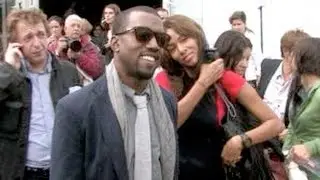 Kanye West and fiancee Alexis Phifer at Issey Miyake SS 2008 Fashion Show in Paris