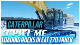 Big excavator working! CAT 374FLME loading rocks in CAT 770