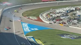 Wall ride and roll over crash at Kansas Speedway, spectator view.