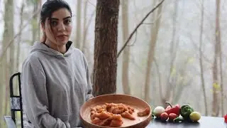 Cooking Chicken Sandwiches Over A Fire In The Rain In The Woods