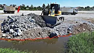 Awesome Bulldozer SHANTUI Filling Pushing stone into Water With Dump Truck 25.5ton Unloading.