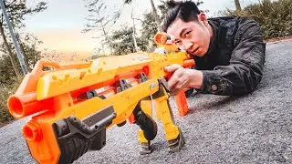 Action Nerf War: Couple Beautiful Girl Nerf Guns Fight Criminal Sleeping in The Forest