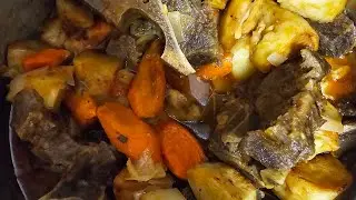 Cooked beef neckbones, Mitchado or beef stew,, with  potatoes and carrots.