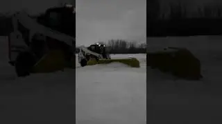 Bobcat A770 with a HLA 1016 expandable wings snow plow