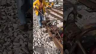 Railroad maintenance: tightening bolts with a track machine