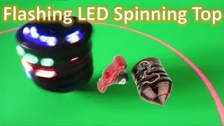 Flashing LED Spinning Top / Peg Top with Music and Laser Light
