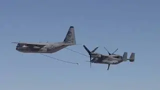 U.S. Marine KC-130J Hercules refuels MV-22B Ospreys over the desert