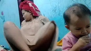 Young mother just finished bathing and washing her hair