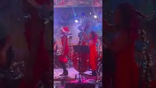 Walker doing rag time at a Pour House Local Christmas jam.