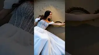 A beautiful bride is drawing a heart in the sand. #bride #heart