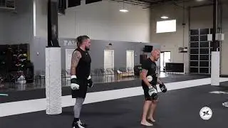 Coach Marc Montoya and Denver Bronco Derek Wolfe Training Session