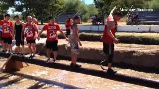 Runners go through muddy water, an ice bath and walk across slick utility poles at Mud Run. #Orovill