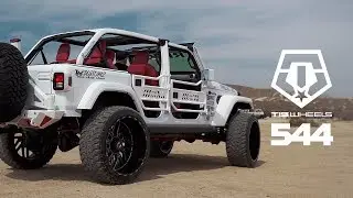 Arctic White Jeep Wrangler on 26x14 TIS 544 Wheels