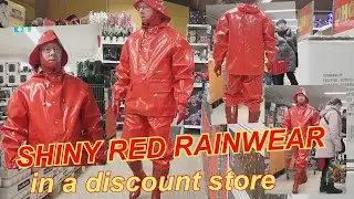 shiny red rainwear in a discount store