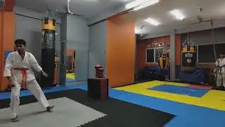 High-flying skills! Karate athletes practicing flying side kicks at WMFC.