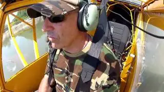 Bush Pilot Water skiing with Taildragger in flight