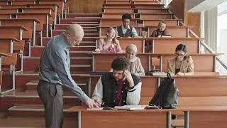 Male Professor Helping Students During Lesson - University - Class // Free Footage