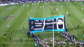 Port Adelaide players running through the 2016 AFL Rd 21 Port Adelaide v Melbourne banner