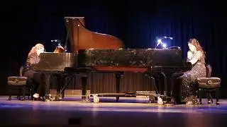 Piano duet playing music of Russian composers.