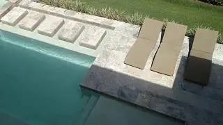 Custom pool and spa with travertine deck and step stones