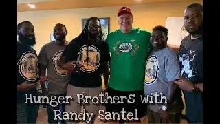 Randy Santel sits with the Hunger Brothers after another food challenge victory