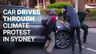 Car almost runs over climate protesters in Sydney, Australia