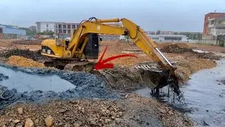 CAT 312C Excavator Scoops Oil Sludge Out - Dirty