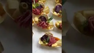 Canape King Pinewood boats charcuterie with musubi loop bamboo skewers.