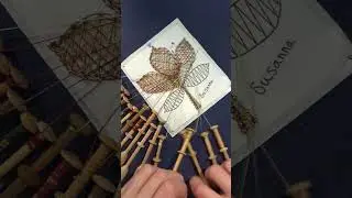 Artist shows the process of making a handmade bobbin lace leaf!