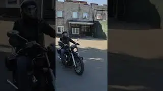 Bikers racing a Harley-Davidson motorcycle.