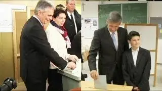 Austria's ruling coalition tipped to edge out right-wing party in general election