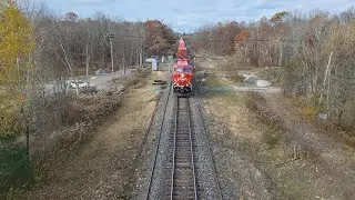 CPKC 112 going underneath me on a overpass in Mactier with units CPKC 7530 leading, 7456, and 7529