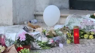 Tributes remain at Lisbon funicular crash site after wreckage fully cleared
