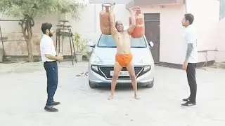 पफस्सि योग;दांतो से गाड़ी खीचते व कनकि उंगलियो से भरे सलेंडर उठाते स्वामी सत्येन्द्र जी