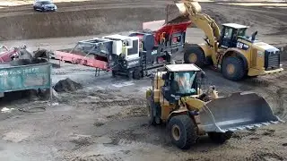 CAT 980M Wheel loader loading SANDVIK QJ 341 Jaw Crusher