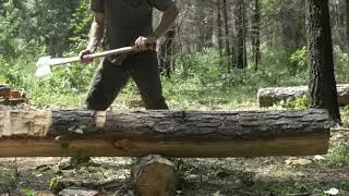 Felling, and Hand hewing a log for a log cabin