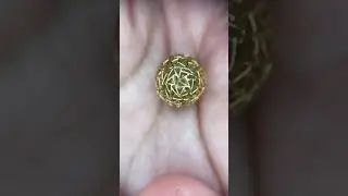 Making all the tiny 18k yellow gold wire into a perfect bubble pendant. Fine Jewelry design/making